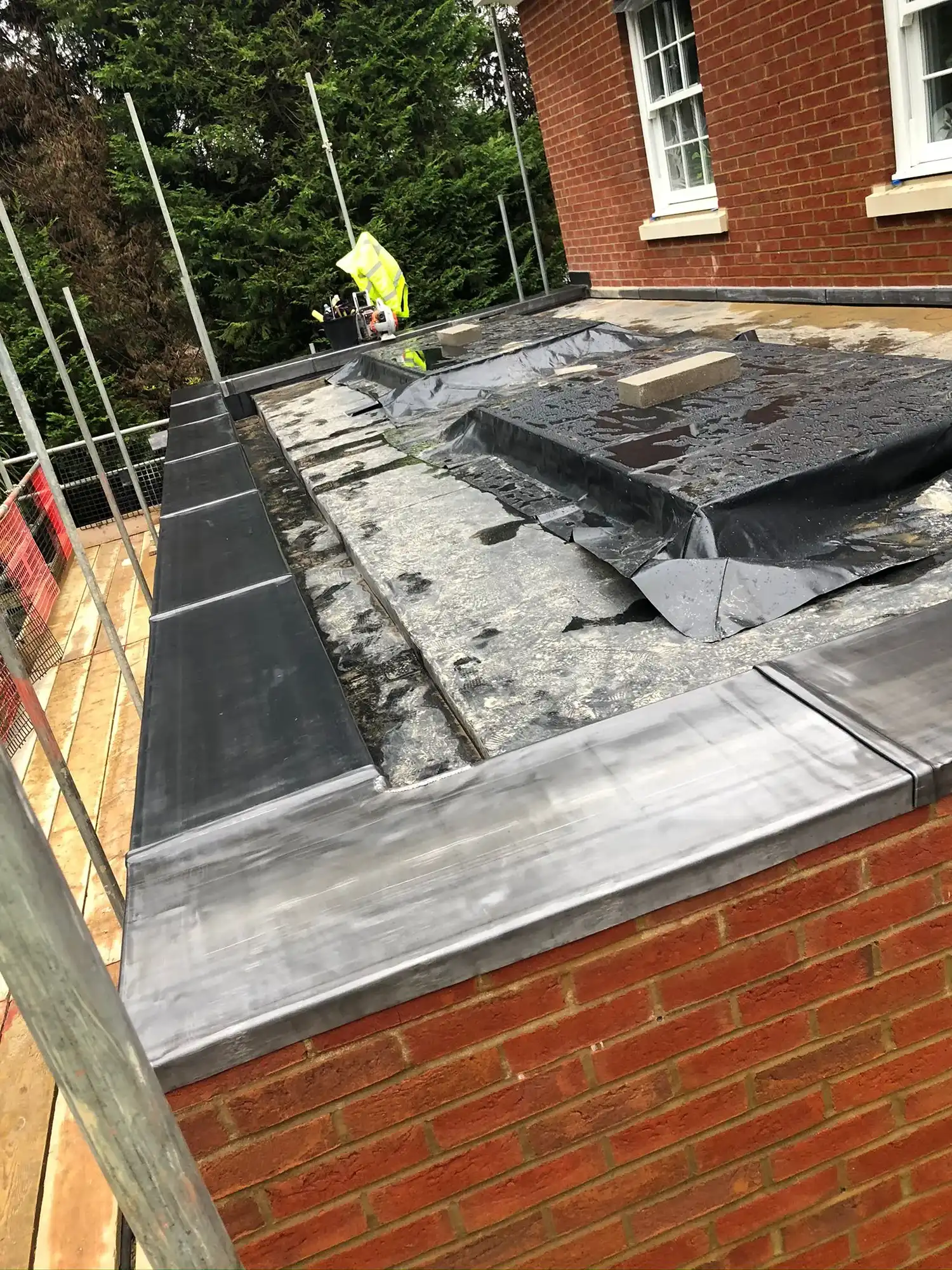 A roof that is being installed on a house.
