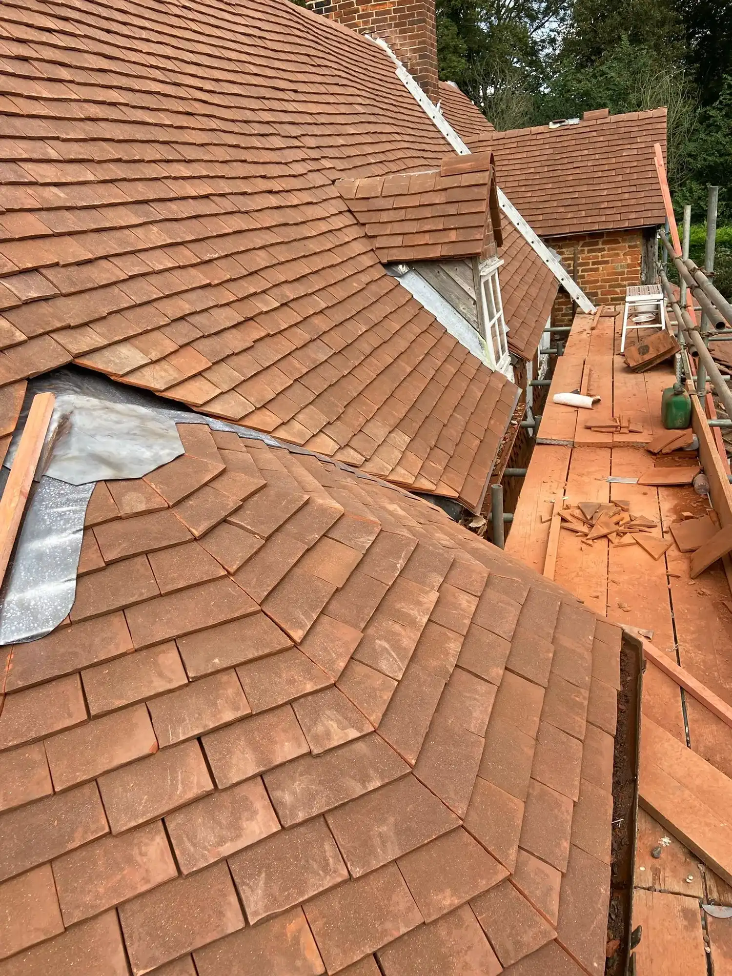 A roof that has been gutted and is being repaired.